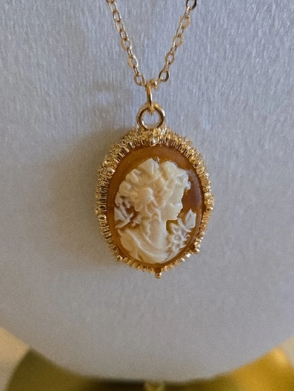 Gold Raised Cameo Pendant Necklace On Intricate Diamond Cut Chain Back in Stock.